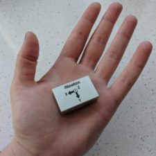 A hand holding an inertial measurement unit